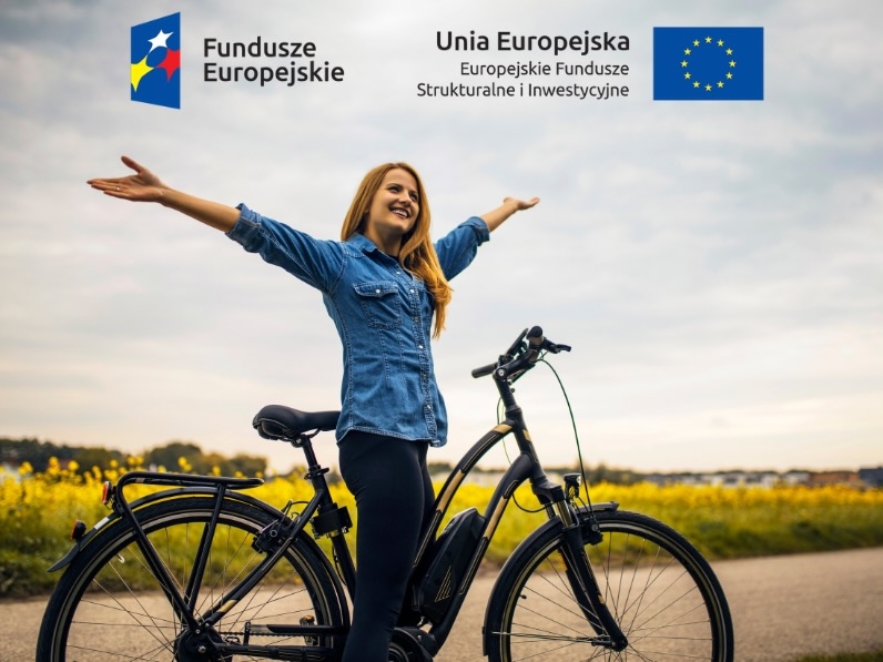 kobieta przy rowerze oraz loga unijne