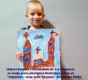 Hubert Stawarz z Przedszkola Nr 5 w Hajnówce ze swoją pracą plastyczną ilustrującą wiersz pt. "Hajnówka - moja mała Ojczyzna" Antoniego Fibika