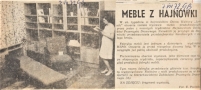 Na zdjęciu: fragment wystawy. Fot. E. Poniecki [skan czarno-białego zdjęcia prasowego, na którym po prawej stronie widoczna jest kobieta w jasnej sukience, trzymająca w rękach książkę; na lewo od niej stoją meble: regały na książki, fotel i fotel rozkładany]