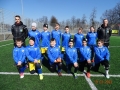 Zdjęcie grupowe drużyny piłkarskiej, ubranej w niebiesko - czarne stroje.