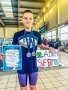 Chłopiec z medalami i dyplomami